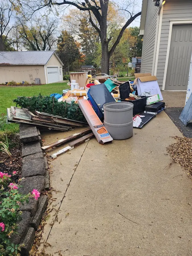 Dumpster being loaded with debris for Commercial Dumpster Rental in Ramapo